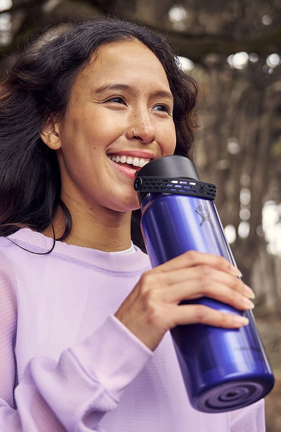 girl drinking out of a lightweight hydro flask