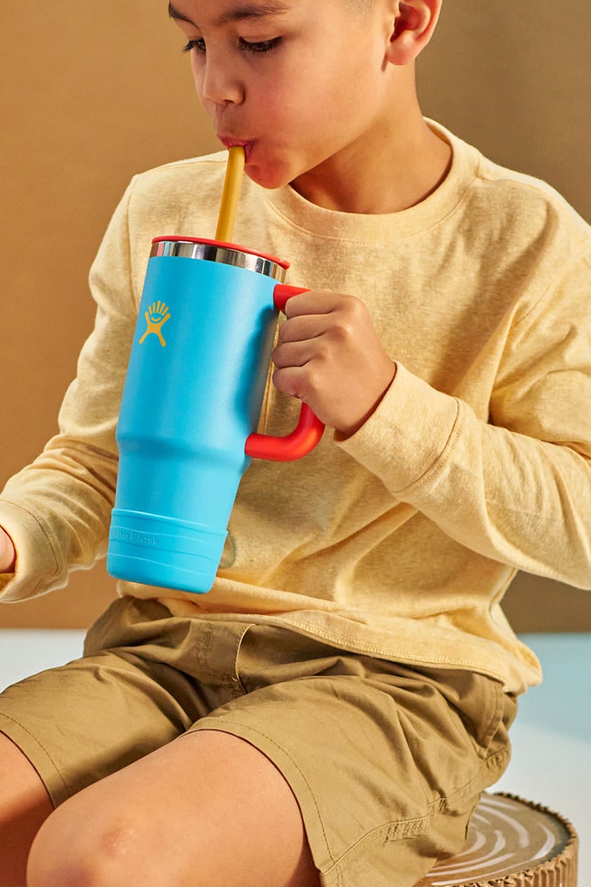 young boy drinking out of a hydro flask kids tumbler